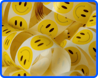 Roll of yellow smiley face stickers